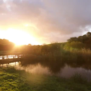 A photo of a sunset and a lake at a spiritual retreat with Clare Hinks Medium in Cornwall